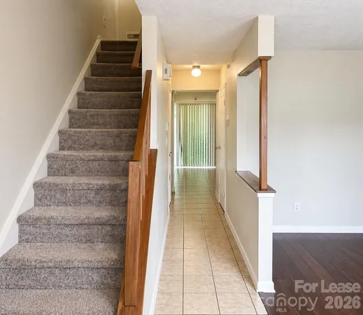 a view of a hallway with stairs