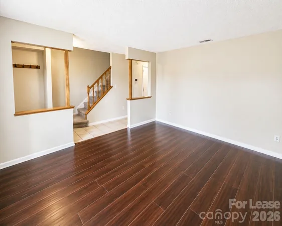 a view of an entryway with wooden floor