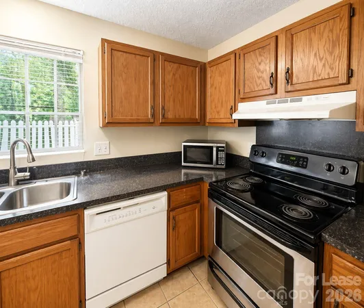 a kitchen with a stove and a sink
