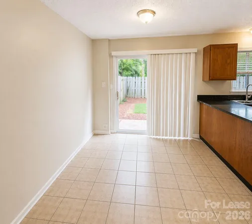 a view of a kitchen with a sink and a window