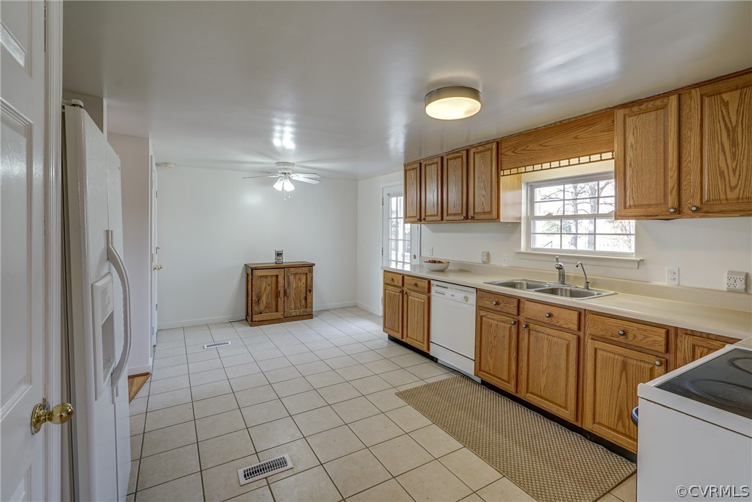 528 Three Chopt Road Manakin-Sabot, VA 23103 - Photo 15 of 50 a large kitchen with a sink window and stainless steel appliances