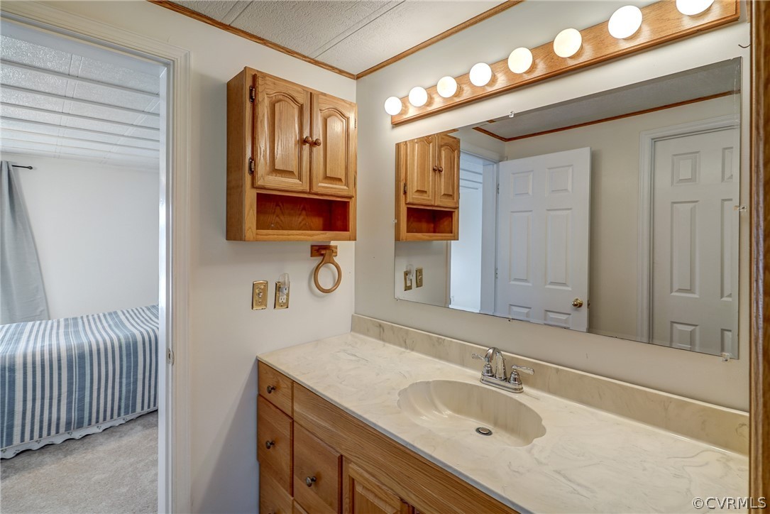528 Three Chopt Road Manakin-Sabot, VA 23103 - Photo 27 of 50 a bathroom with a granite countertop sink and a mirror