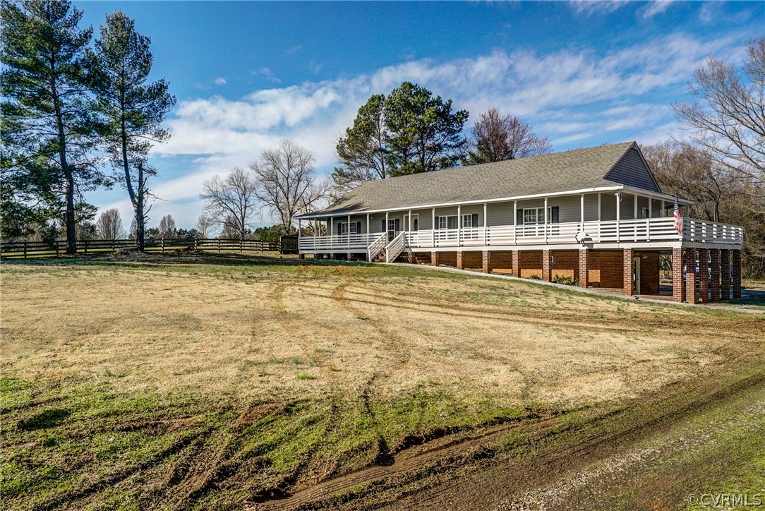 528 Three Chopt Road Manakin-Sabot, VA 23103 - Photo 49 of 50 a view of a house with pool and trees in the background
