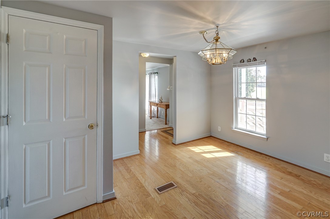 528 Three Chopt Road Manakin-Sabot, VA 23103 - Photo 10 of 50 wooden floor in an empty room with a window