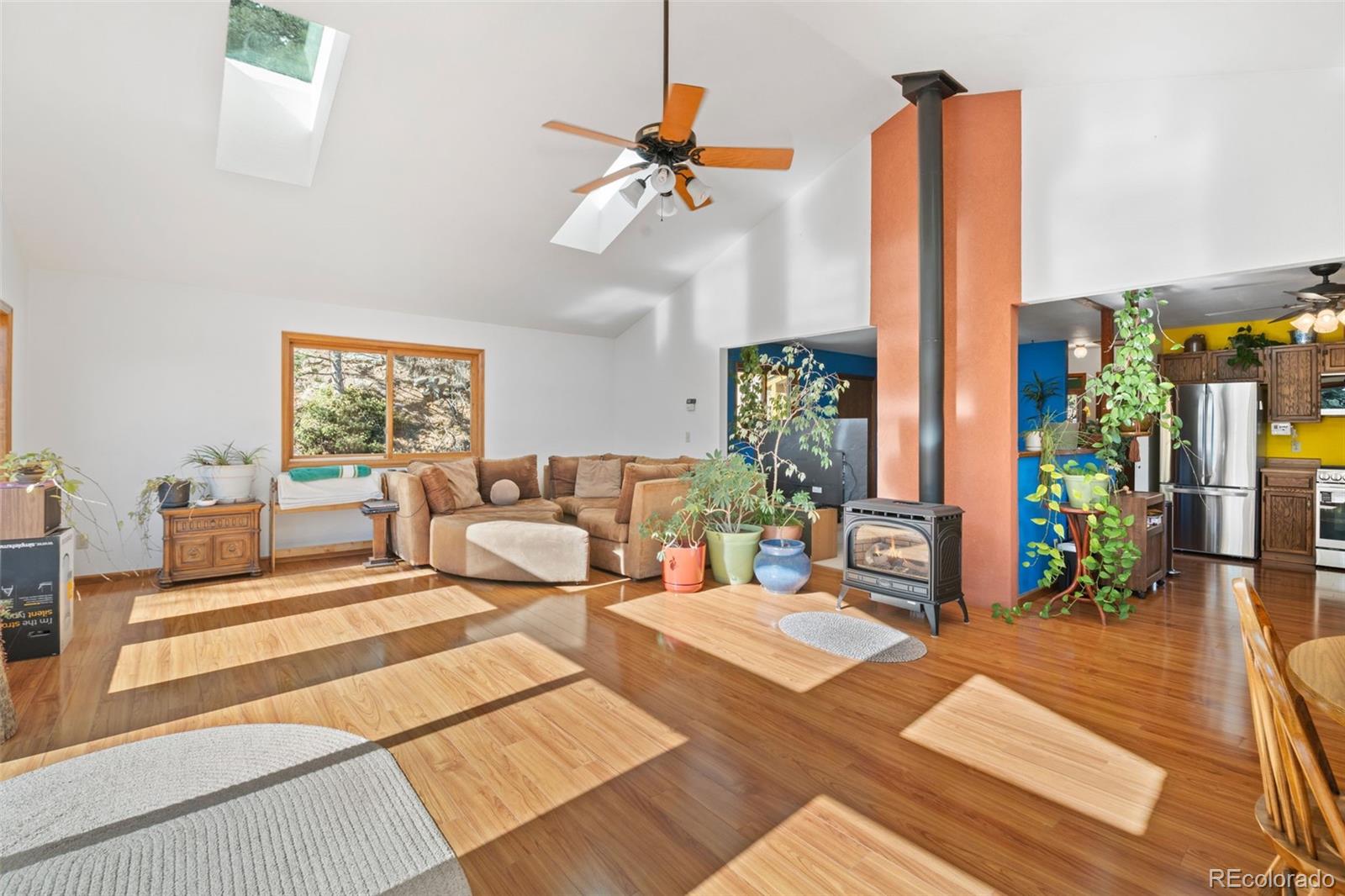 1269 Roland Drive Bailey, CO 80421 - Photo 14 of 38 a living room with patio furniture and a chandelier