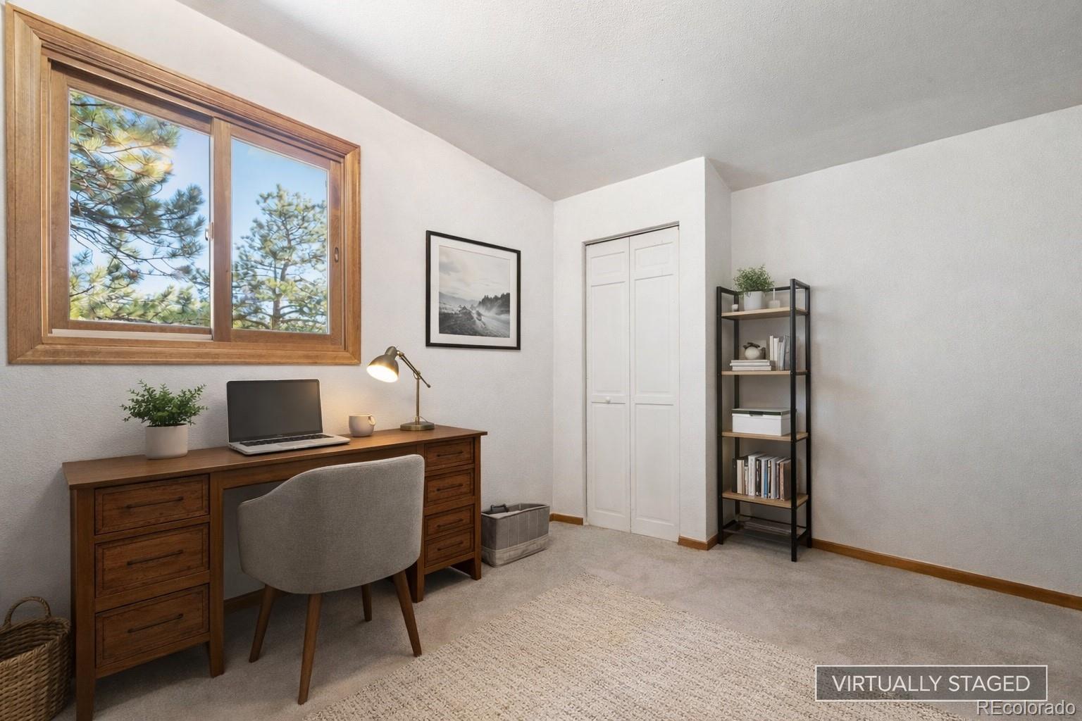 1269 Roland Drive Bailey, CO 80421 - Photo 28 of 38 a view of a workspace with furniture and a window