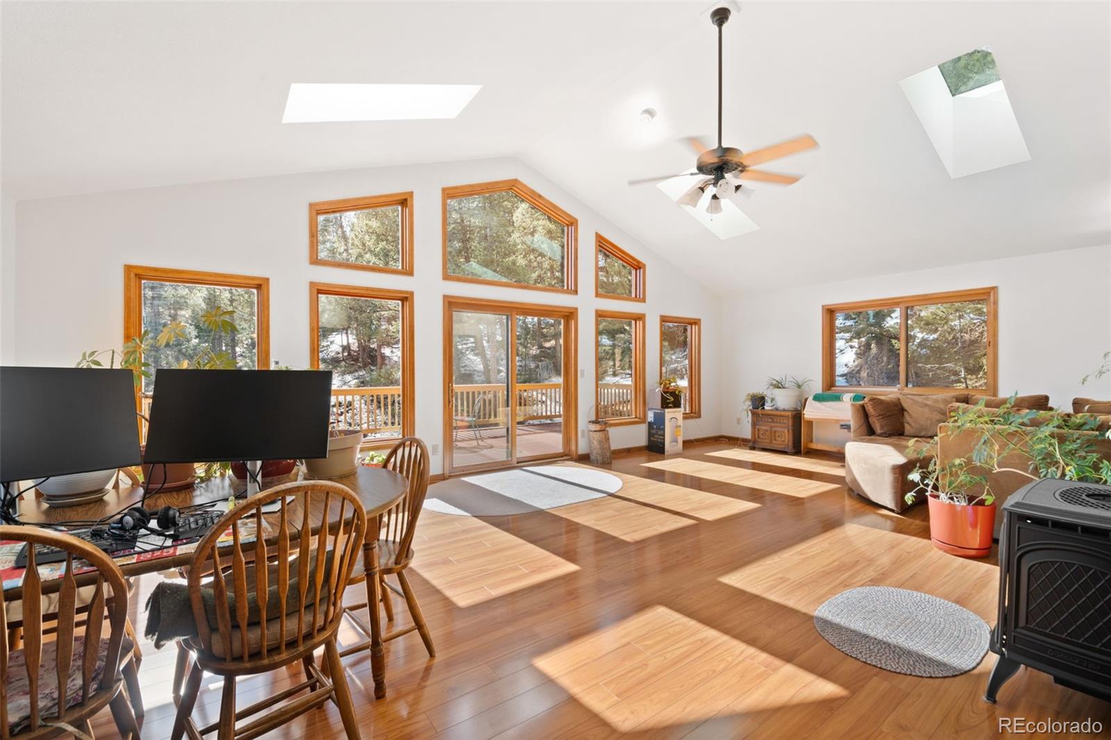 1269 Roland Drive Bailey, CO 80421 - Photo 9 of 38 a bedroom with a bed and wooden floor