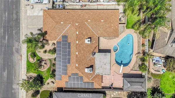 an aerial view of a house with a garden