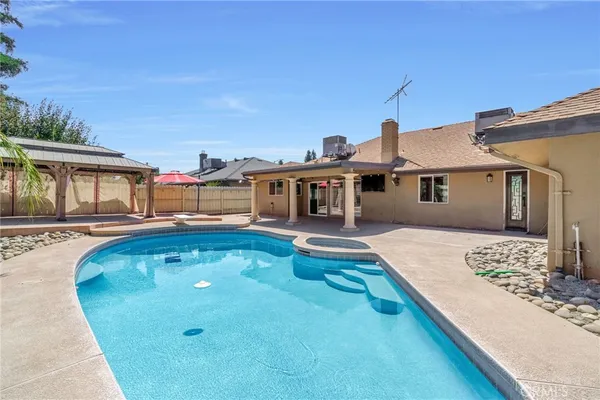 a front view of a house with swimming pool