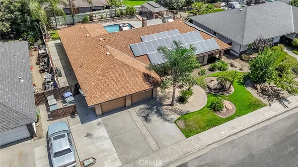 an aerial view of house with yard