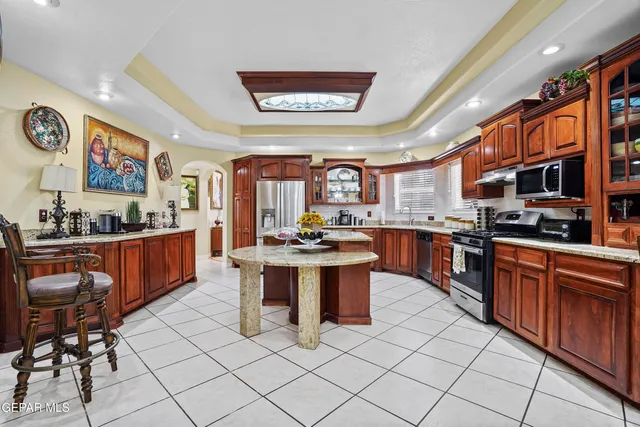 a kitchen with a sink and a refrigerator