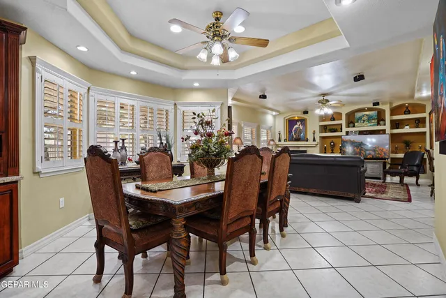 a living room with fireplace furniture and a flat screen tv