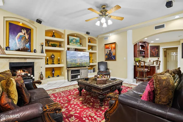 a living room with furniture and a rug