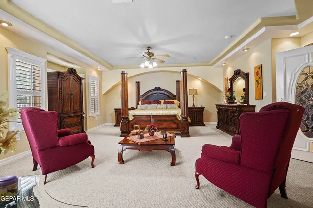 a bathroom with a sink a mirror a toilet and a shower