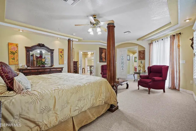 a living room with furniture a rug and a flat screen tv