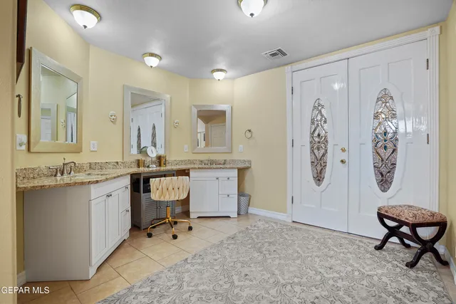 a view of walk in closet with clothes