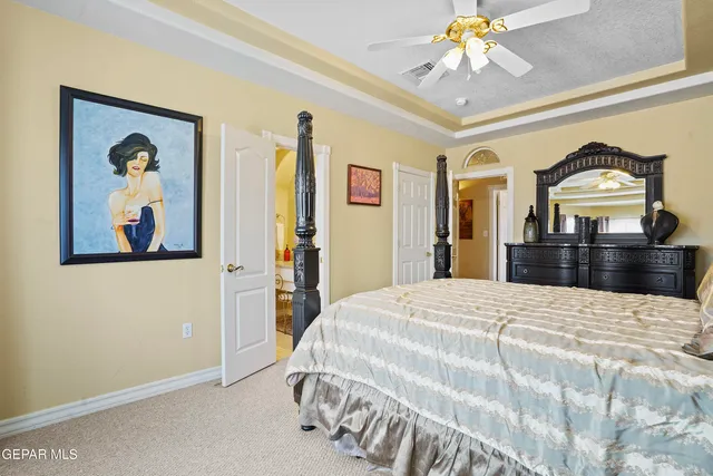 a bedroom with furniture and a chair