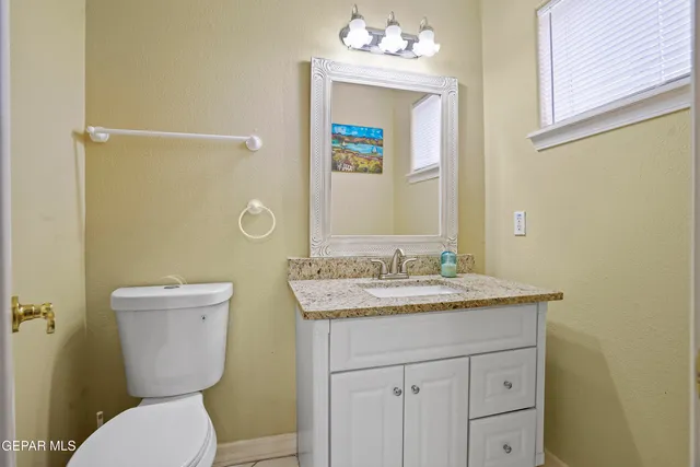 a view of a house with pool and chairs