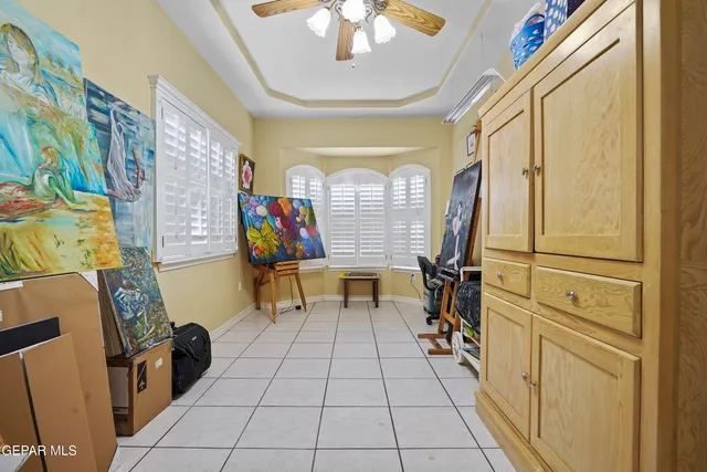 a living room with furniture a rug and white walls