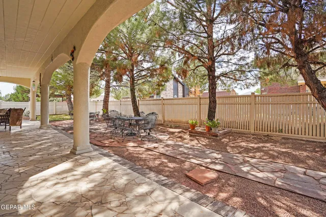 an aerial view of residential houses with yard
