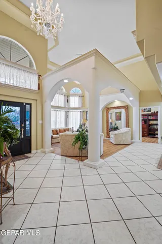 a view of living room filled with furniture and a large window