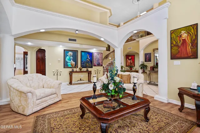 a kitchen with stainless steel appliances granite countertop a stove top oven a sink dishwasher and cabinets with chairs