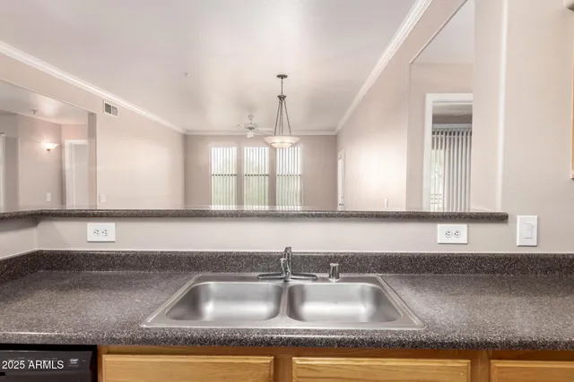 a kitchen with granite countertop a sink and a granite counter tops
