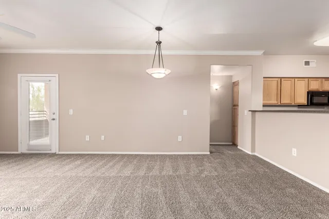 a view of a kitchen with a sink and cabinets