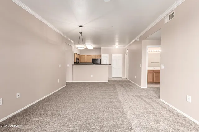 a view of a kitchen with a sink and a window