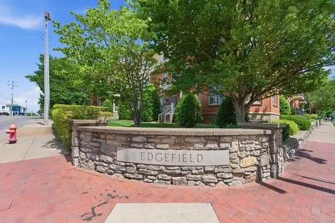 a view of a building with a yard