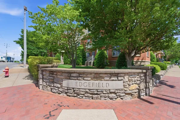 a view of a building with a yard