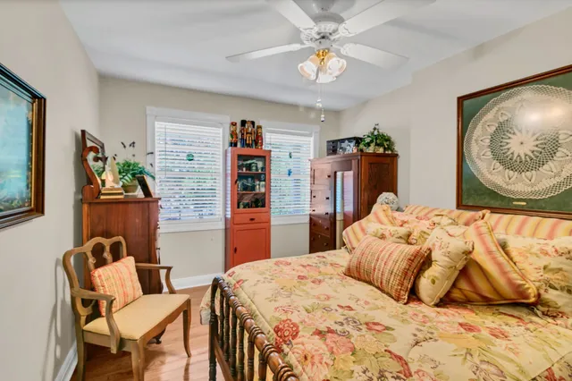 a bedroom with a bed and dresser
