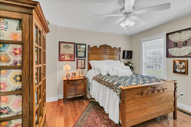 a bedroom with a bed and dresser