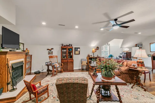 a view of a livingroom with furniture and a flat screen tv