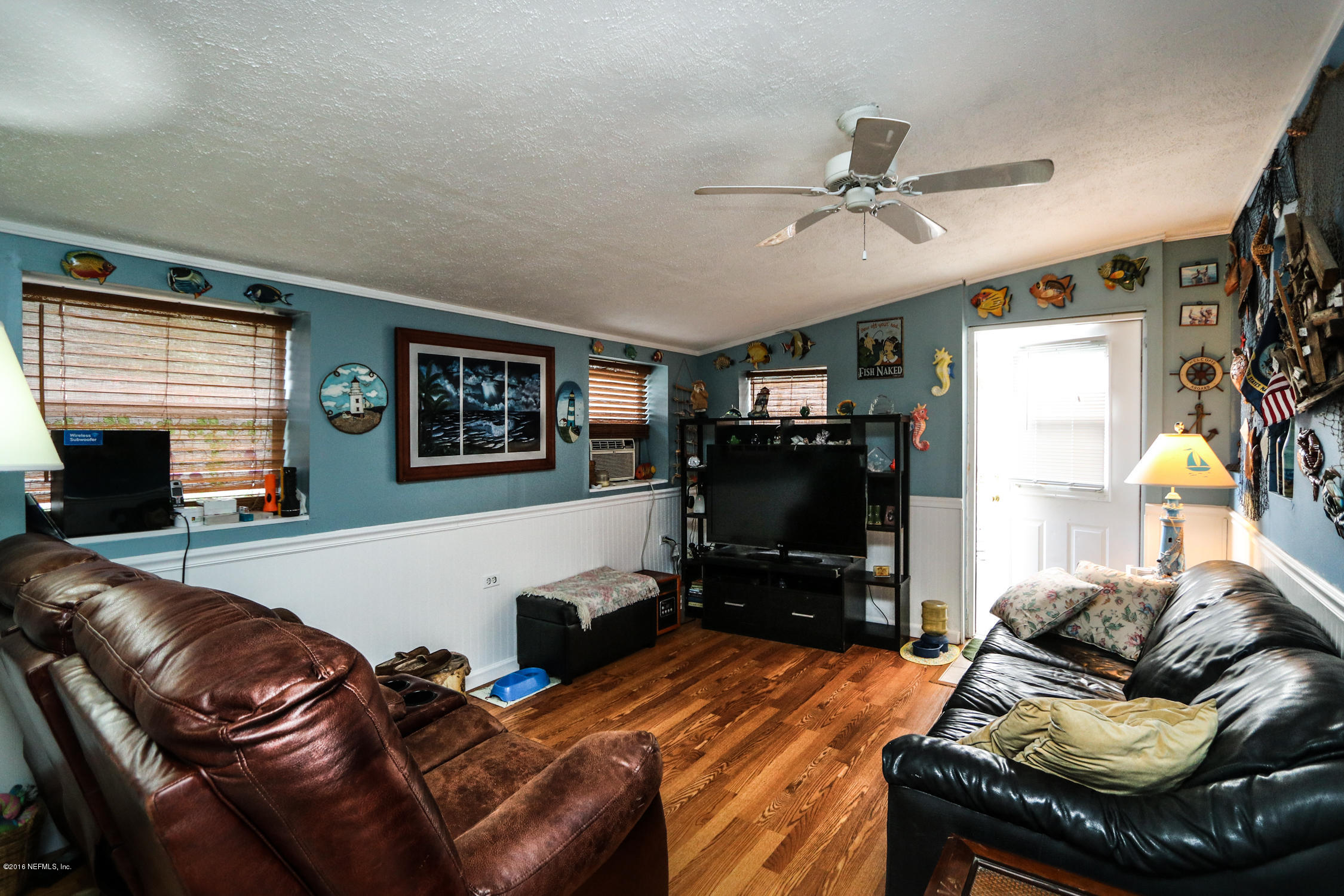 7648 Rambler Road Jacksonville, FL 32244 - Photo 14 of 29 a living room with furniture and a flat screen tv