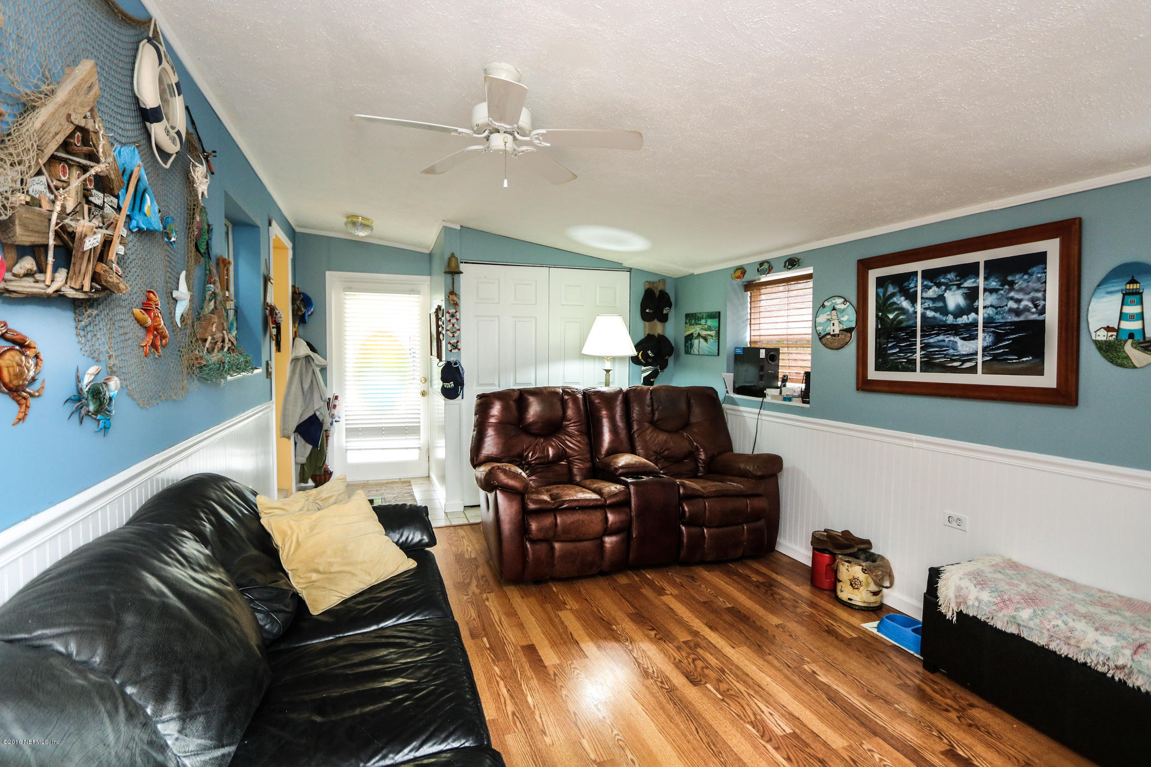 7648 Rambler Road Jacksonville, FL 32244 - Photo 16 of 29 a living room with furniture and painting on the wall