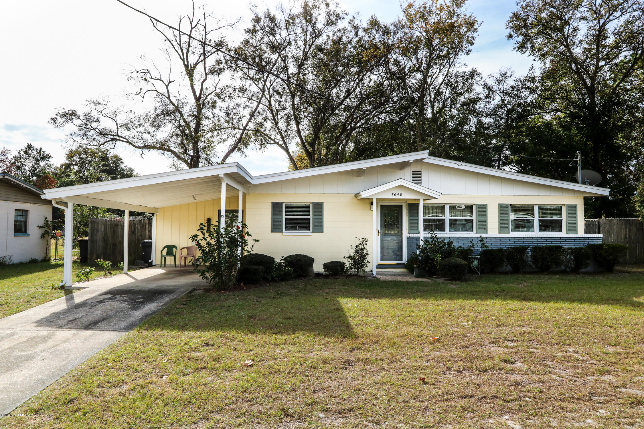 7648 Rambler Road Jacksonville, FL 32244 - Photo 2 of 29 a front view of a house with a yard