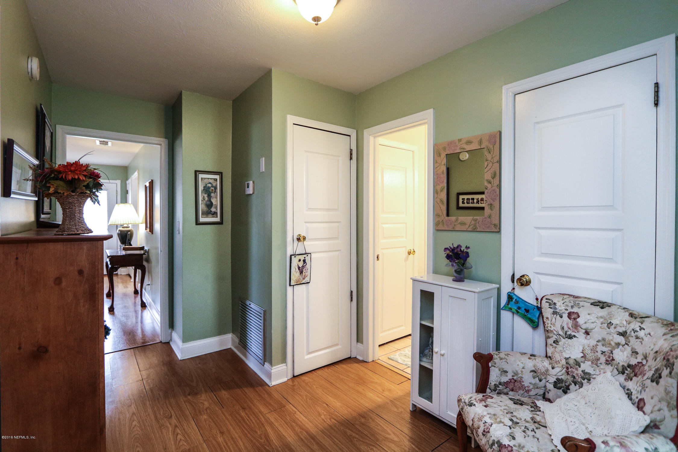 7648 Rambler Road Jacksonville, FL 32244 - Photo 22 of 29 a view of a livingroom with furniture and wooden floor