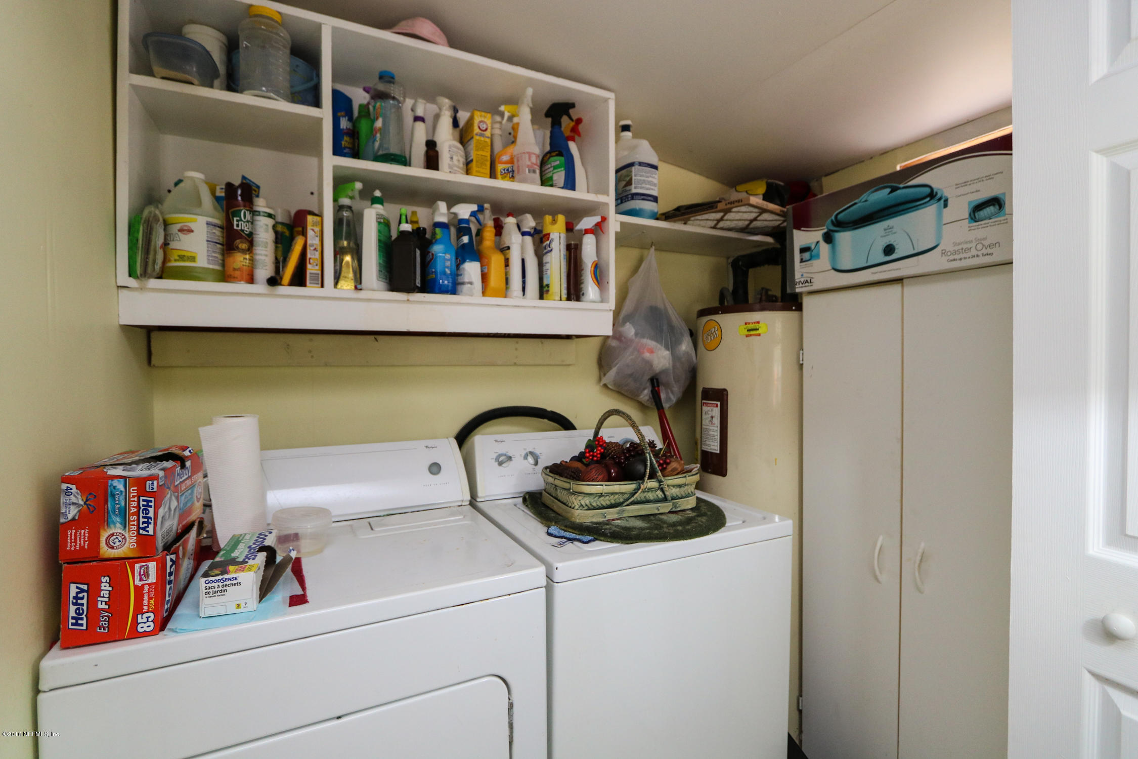 7648 Rambler Road Jacksonville, FL 32244 - Photo 23 of 29 a room with storage and utility racks