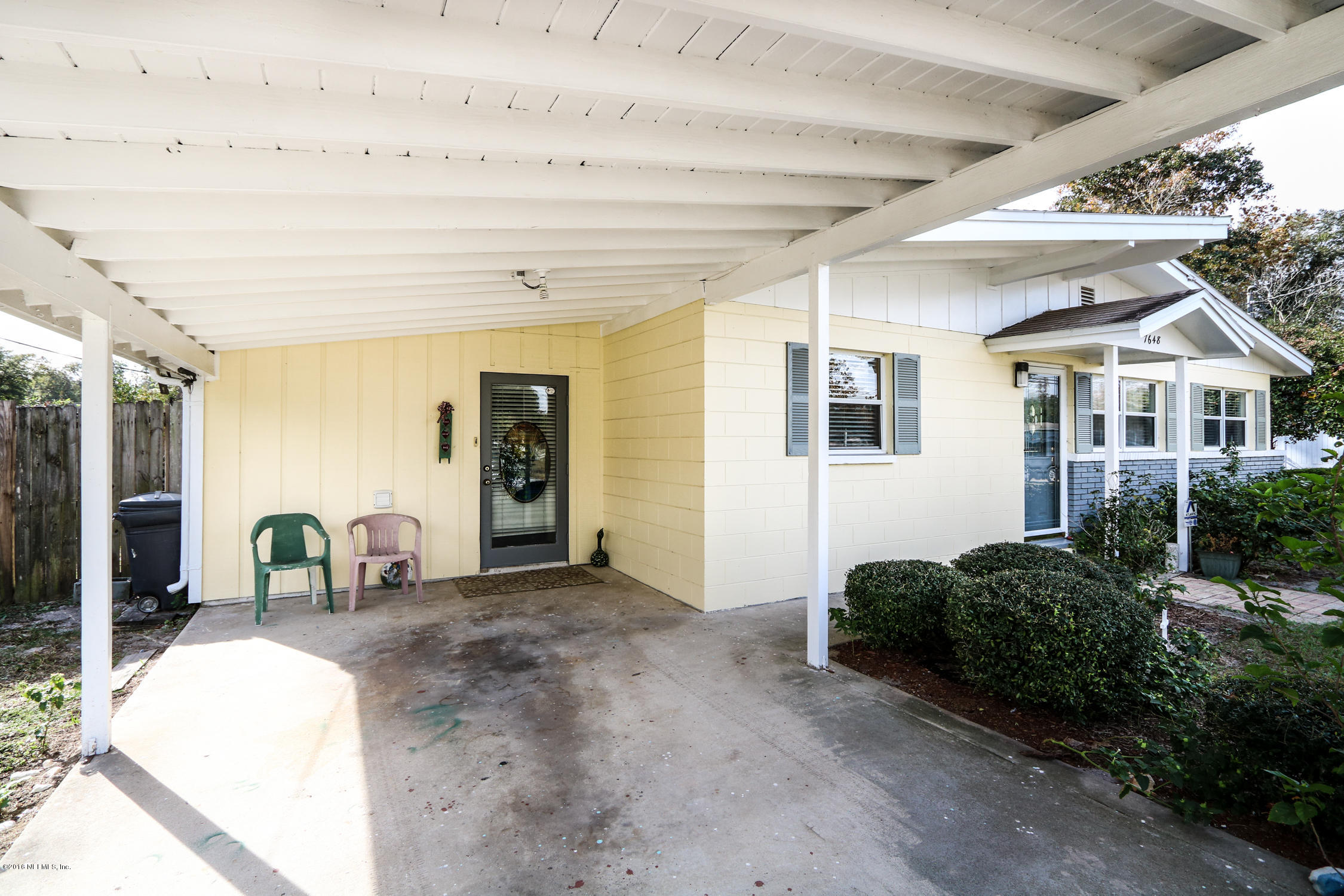 7648 Rambler Road Jacksonville, FL 32244 - Photo 28 of 29 a view of backyard with wheel chair and potted plants