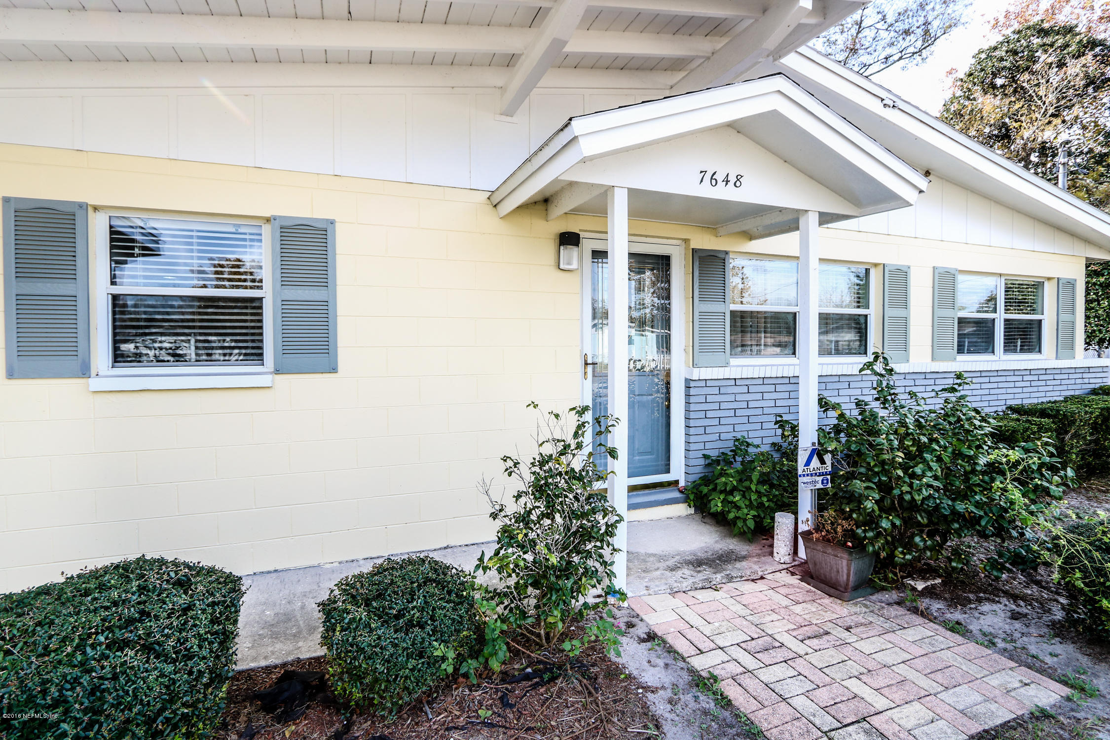7648 Rambler Road Jacksonville, FL 32244 - Photo 3 of 29 a front view of a house with garden