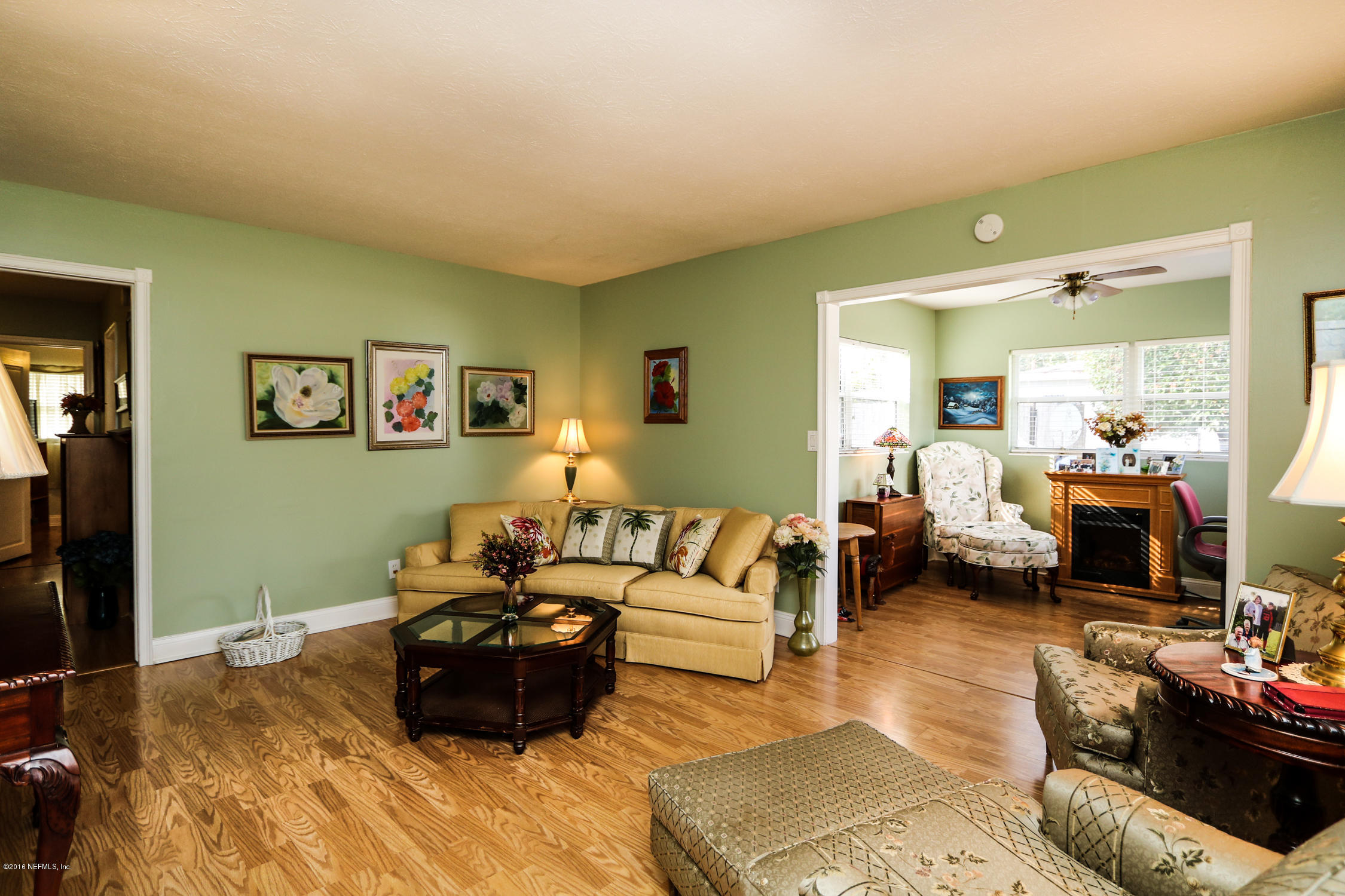 7648 Rambler Road Jacksonville, FL 32244 - Photo 5 of 29 a living room with furniture and a couch