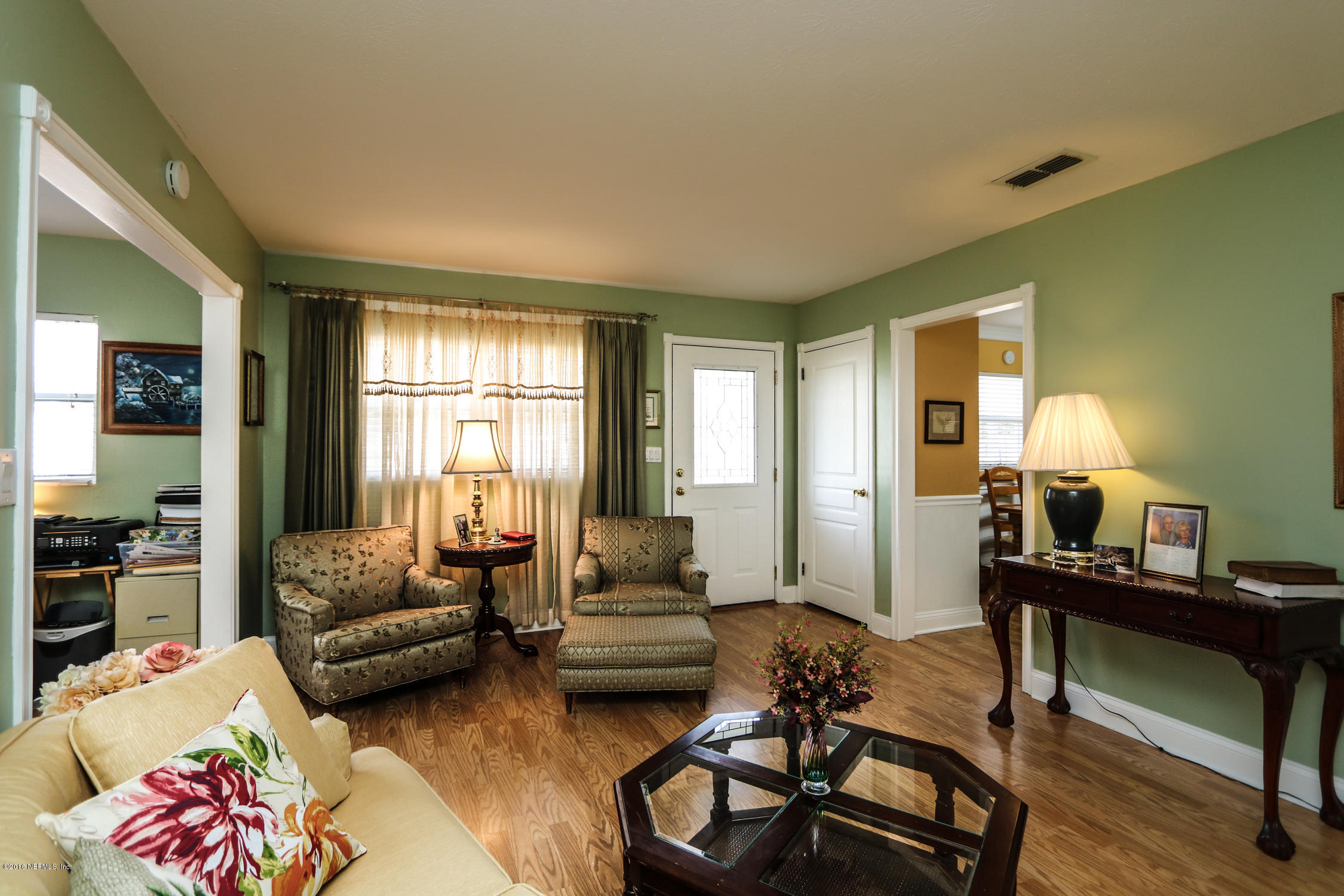 7648 Rambler Road Jacksonville, FL 32244 - Photo 6 of 29 a living room with furniture and a window