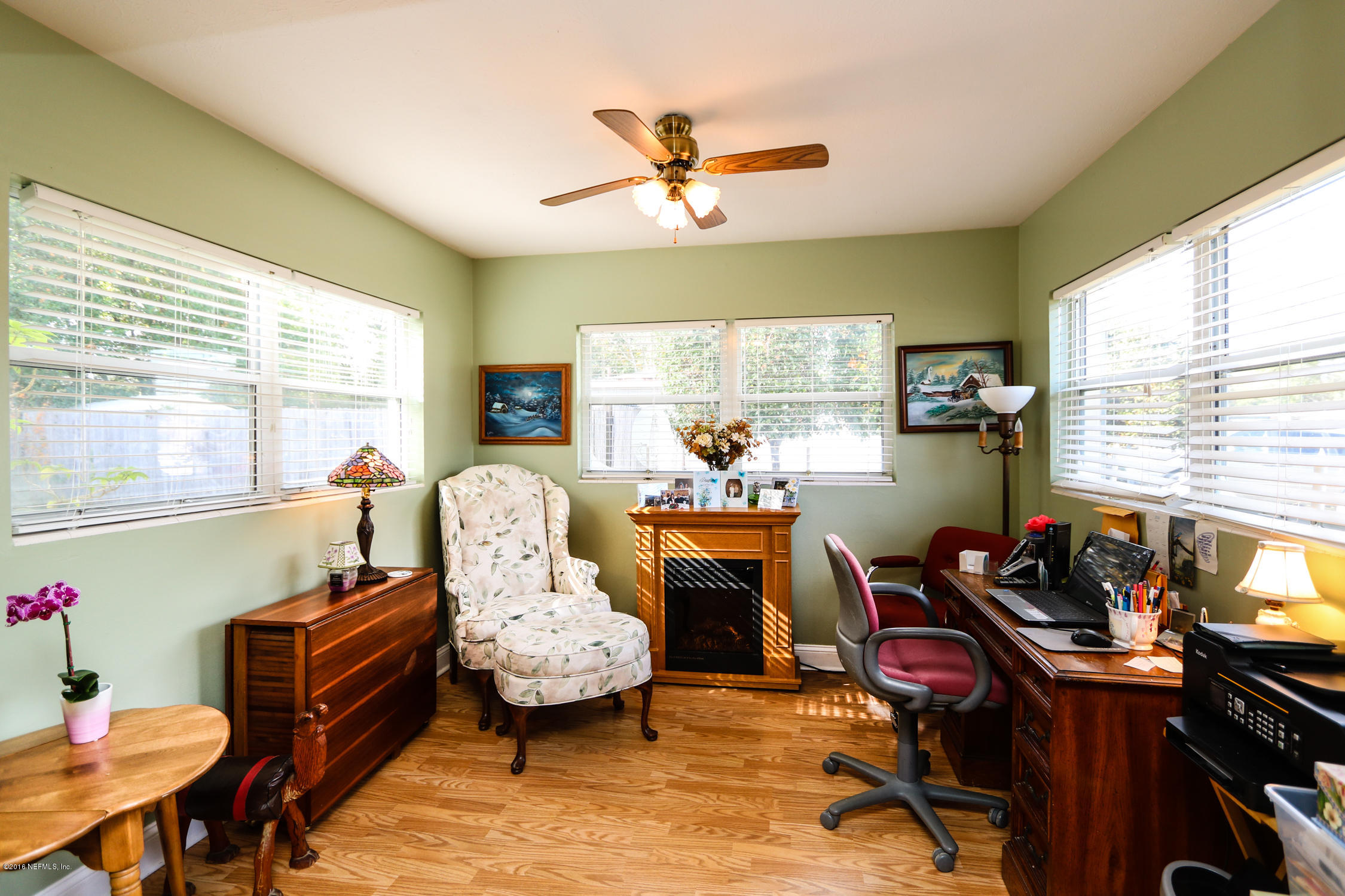 7648 Rambler Road Jacksonville, FL 32244 - Photo 8 of 29 a living room with furniture and a large window