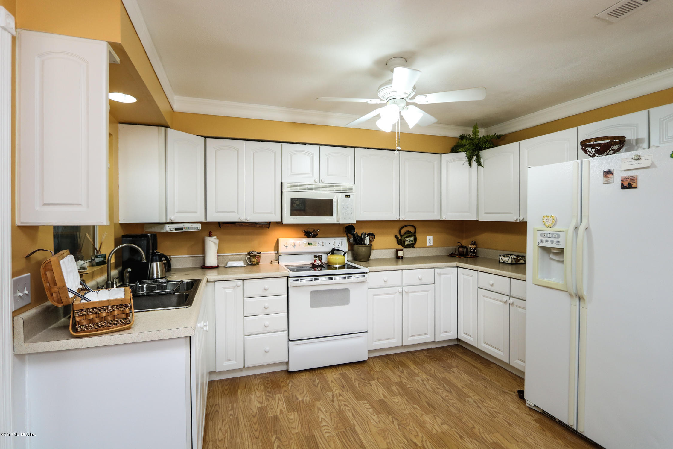 7648 Rambler Road Jacksonville, FL 32244 - Photo 10 of 29 a kitchen with stainless steel appliances granite countertop a sink and cabinets
