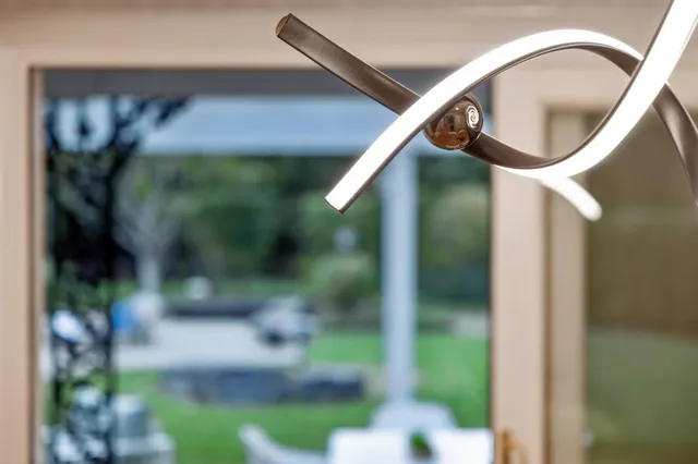 a bedroom with a bed and a potted plant