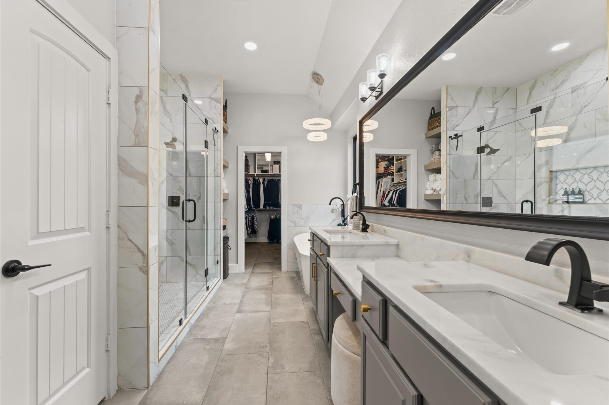 14016 Savannah Landing Lane Rosharon, TX 77583 - Photo 25 of 49 a bathroom with a tub sink and mirror