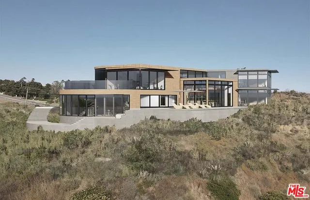 a view of a house with outdoor space and sitting area