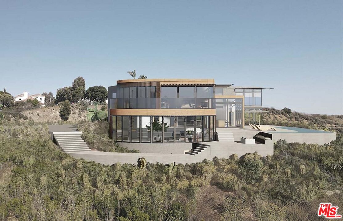 6111 Kanan Dume Road Malibu, CA 90265 - Photo 14 of 14 a view of a house with outdoor space and sitting area