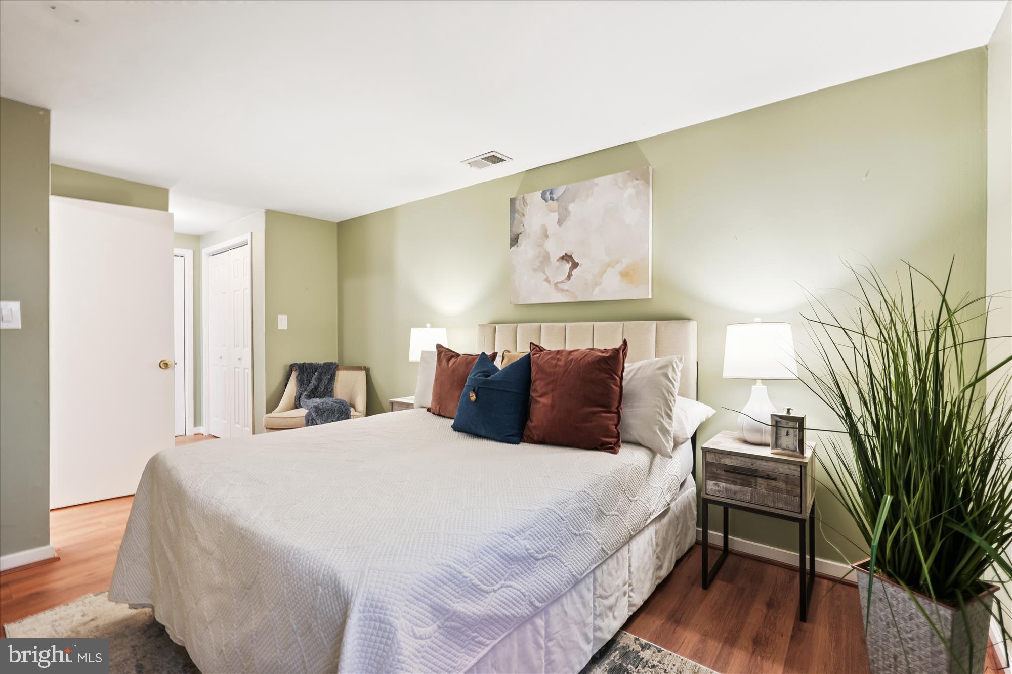 9731 Hellingly Place, Unit 37 Montgomery Village, MD 20886 - Photo 12 of 20 a bedroom with a bed and wooden floor